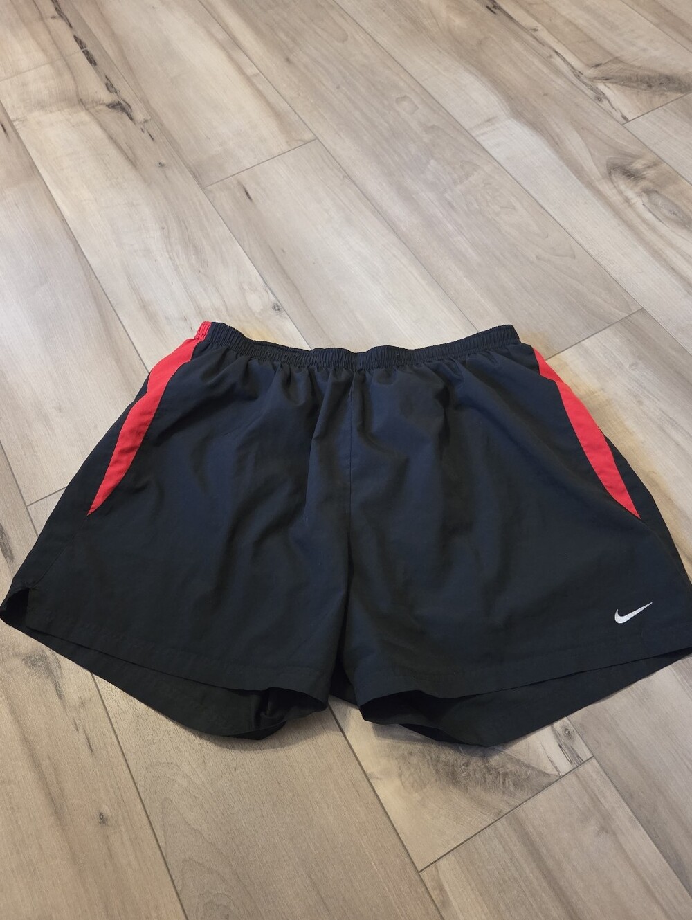 Nike men’s Black Running Shorts with Red Accent